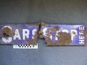 blue and white rusted railway sign
