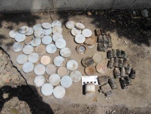 round and cylindrical containers laid out on the ground